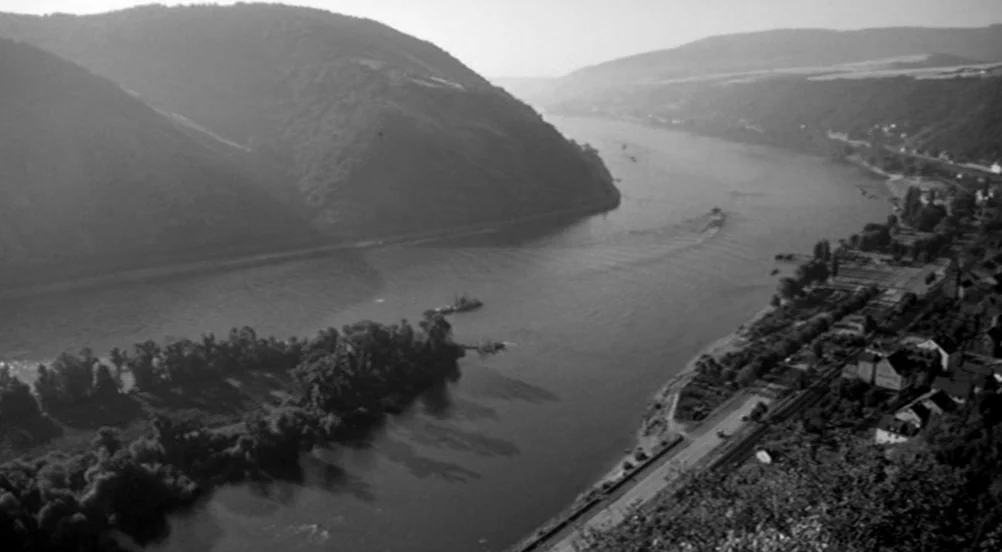 Kings of the Road (Im Lauf der Zeit) (1976) movie still: establishing — A wide river winds through a deep valley bordered by steep, forested…