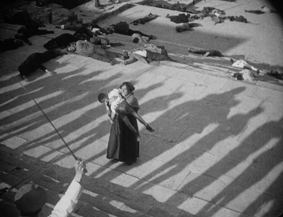 Battleship Potemkin (1925) movie still: wide — Wide, elevated perspective of stone steps covered with multiple bodies lying motionless. A solitary…