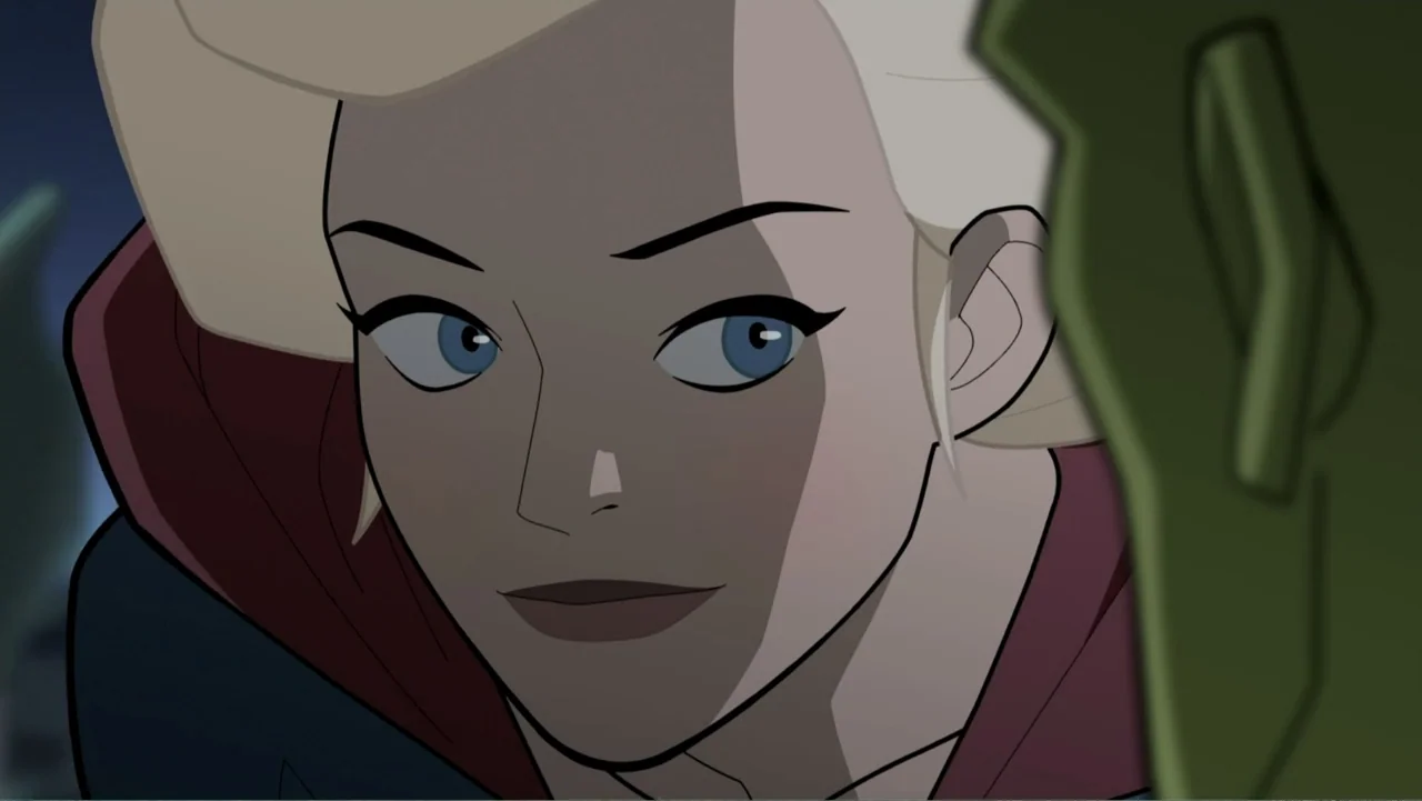 Legion of Super-Heroes (2023) movie still: closeup — A close-up of a blonde woman's face shown from a side-angled perspective. She is looking at an…