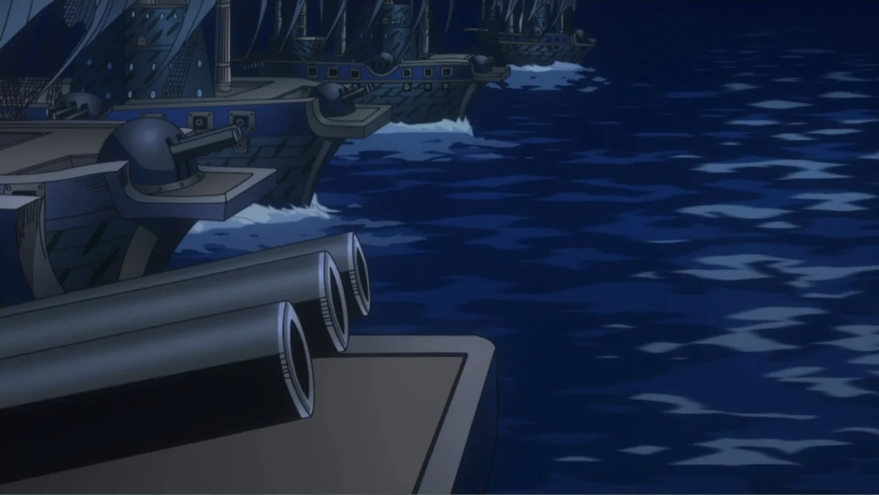One Piece Film: GOLD (2016) movie still: wide — A dark ocean expanse contains several wooden sailing ships moving in a fleet formation. The vessels…