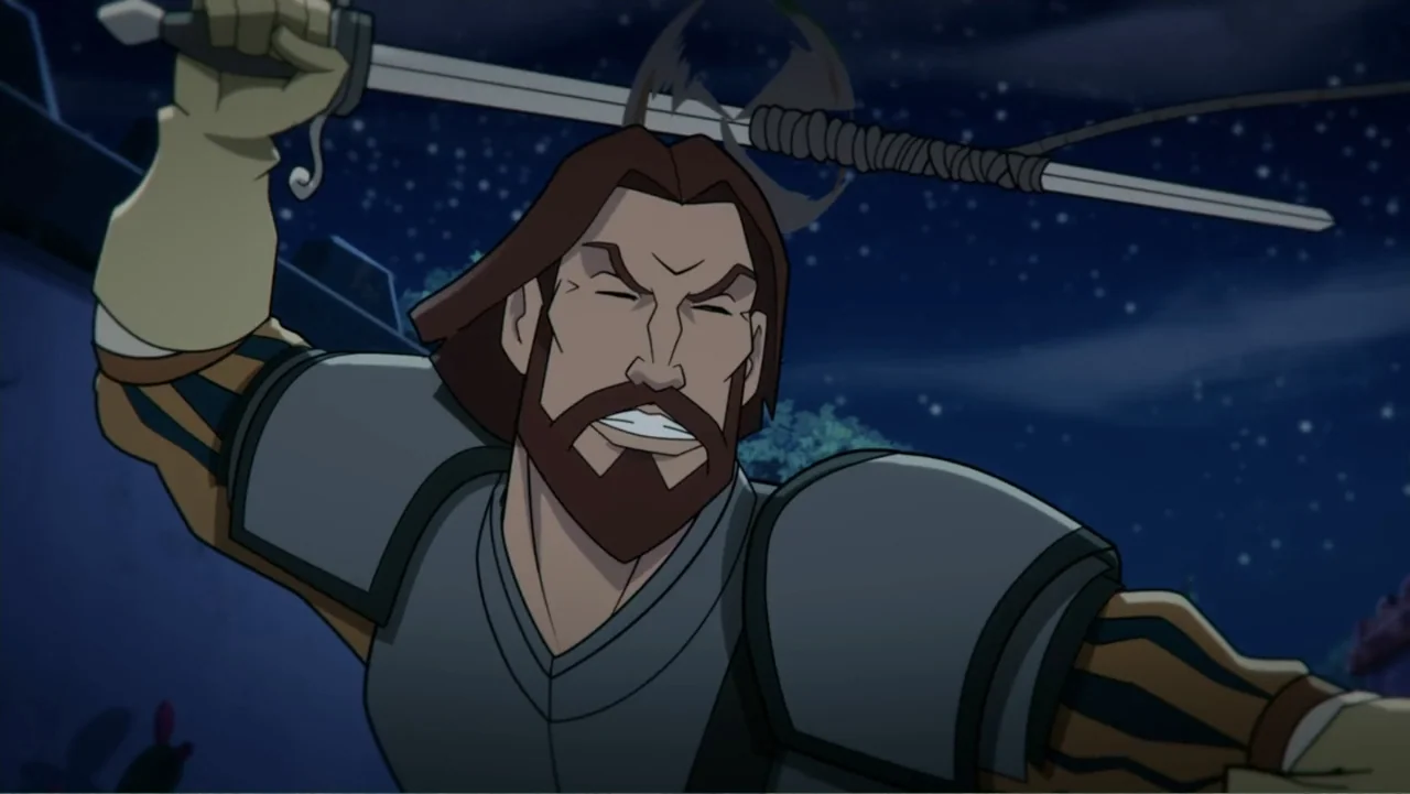 Aztec Batman: Clash of Empires (2025) movie still: medium — A man in medieval-style armor stands outdoors under a dark, starry night sky. The man…