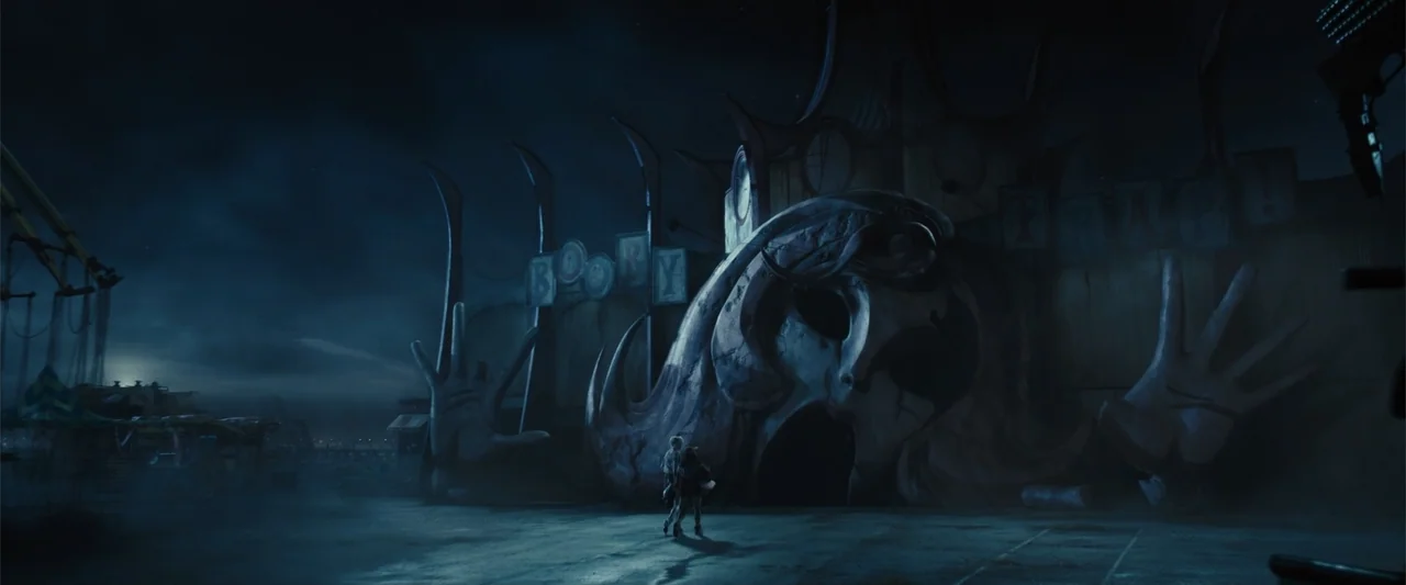 Birds of Prey (and the Fantabulous Emancipation of One Harley Quinn) (2020) movie still: wide — A dark, ominous amusement park entrance features a…