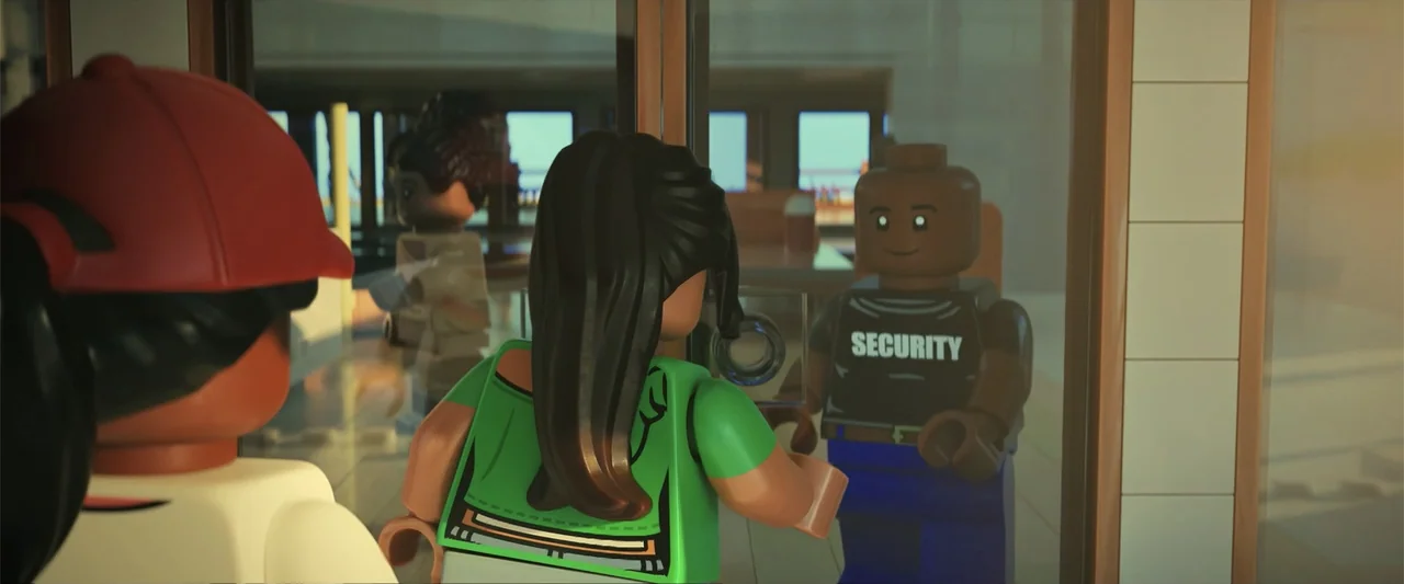 Piece by Piece (2024) movie still: medium — A modern building lobby featuring glass doors and tiled wall sections. A woman in a green shirt…