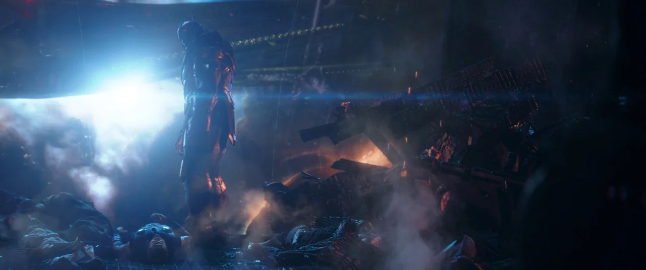 Avengers: Infinity War (2018) movie still: wide — A dark, destroyed space vessel interior is filled with debris and glowing orange fire. A large,…
