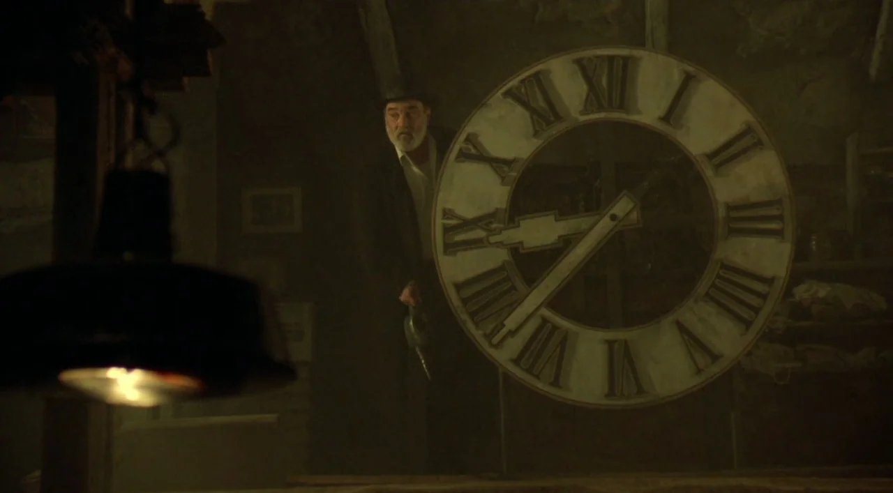 Underground (1995) movie still: medium — A dimly lit, cluttered workshop features a large wooden clock face as a focus. An elderly man stands beside…