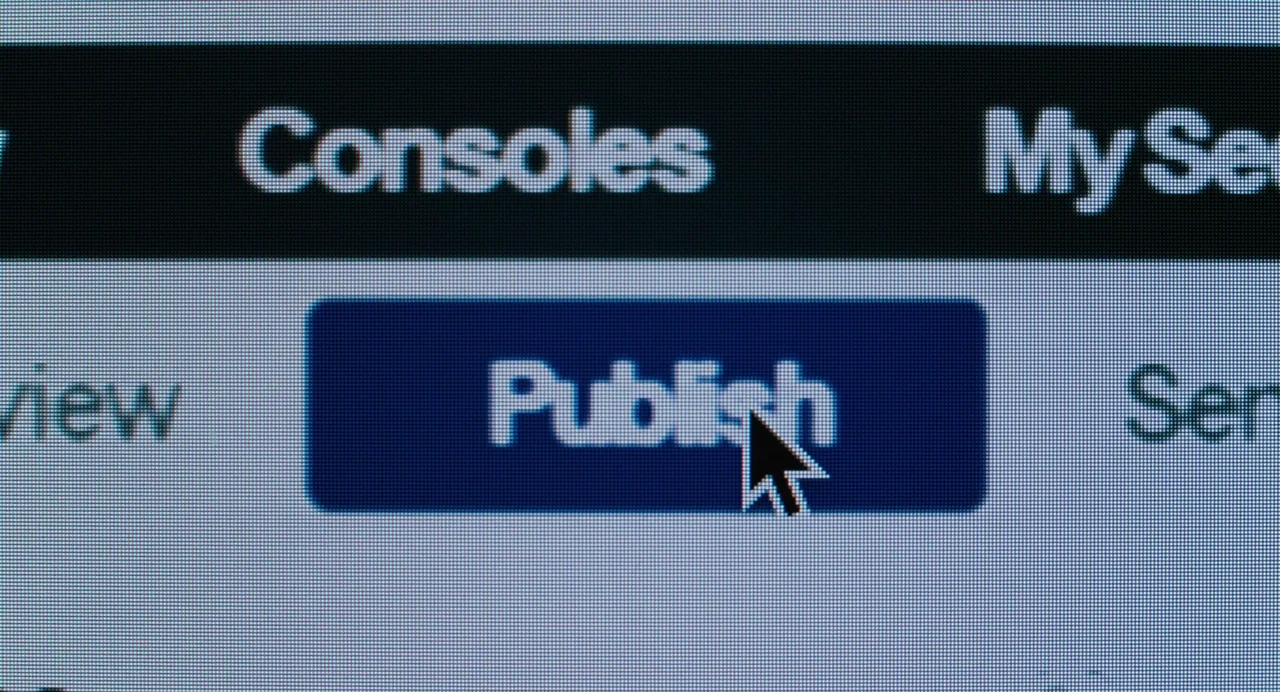 She Said (2022) movie still: closeup — A close-up view of a computer monitor displaying a digital user interface. A mouse cursor is positioned…