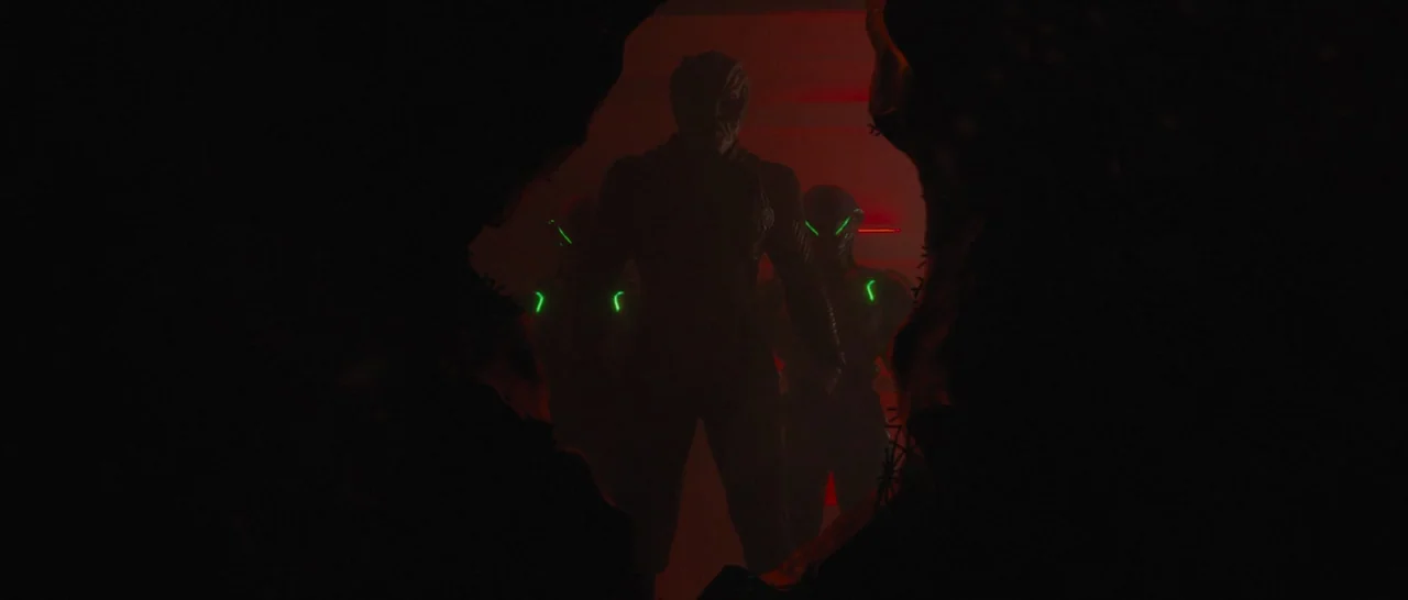 Star Trek Beyond (2016) movie still: medium — A dark, jagged opening reveals shadowy figures standing in a red-lit environment. The armored figures…