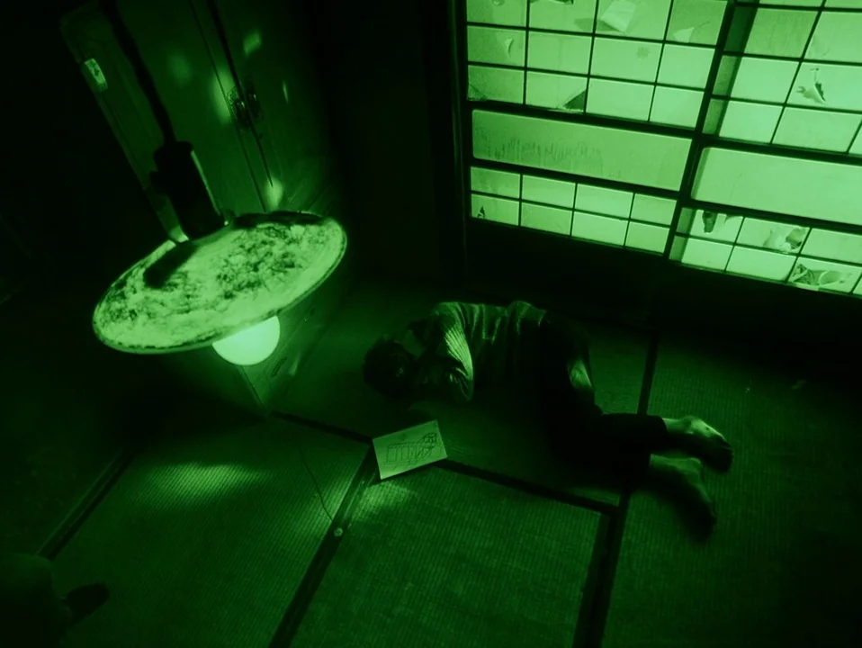Throw Away Your Books, Rally in the Streets (1971) movie still: wide — A dark room with traditional straw mats and shoji screens illuminated by…