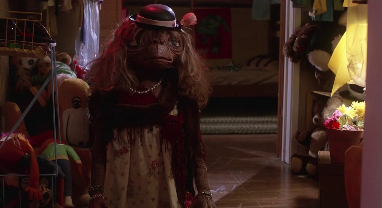 E.T. The Extra-Terrestrial (1982) movie still: medium — A cluttered room is filled with various stuffed animals and household objects. An…