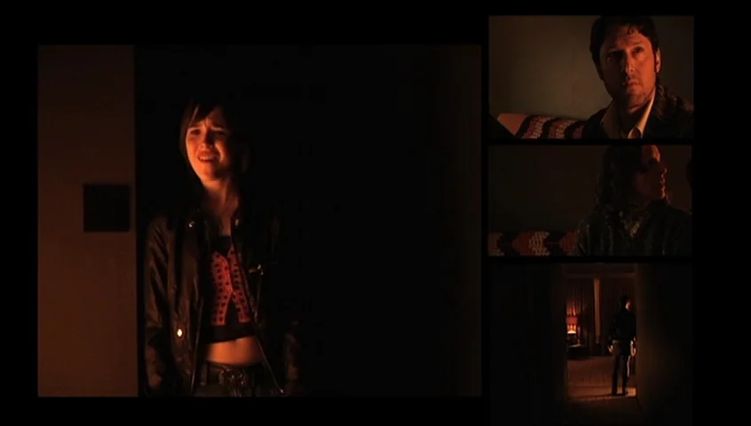 The Tracey Fragments (2007) movie still: medium — A dimly lit room features a young person standing in a doorway near dark furniture. Other panels…