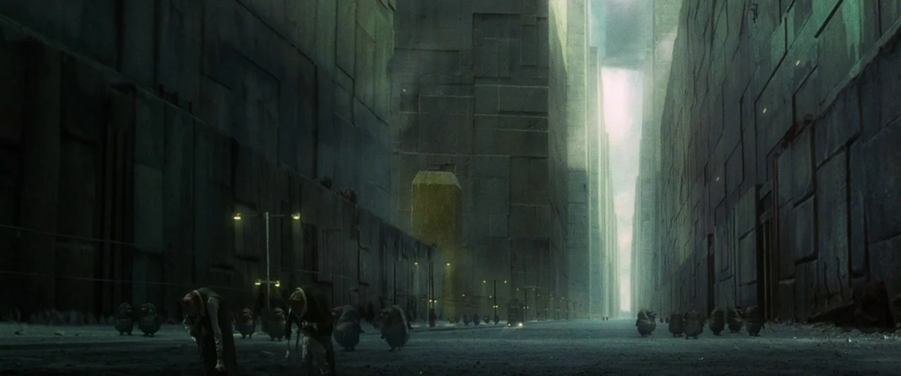 A Hitchhiker’s Guide To The Galaxy (2005) movie still: establishing — An immense, narrow canyon-like street is lined by towering, monolithic…
