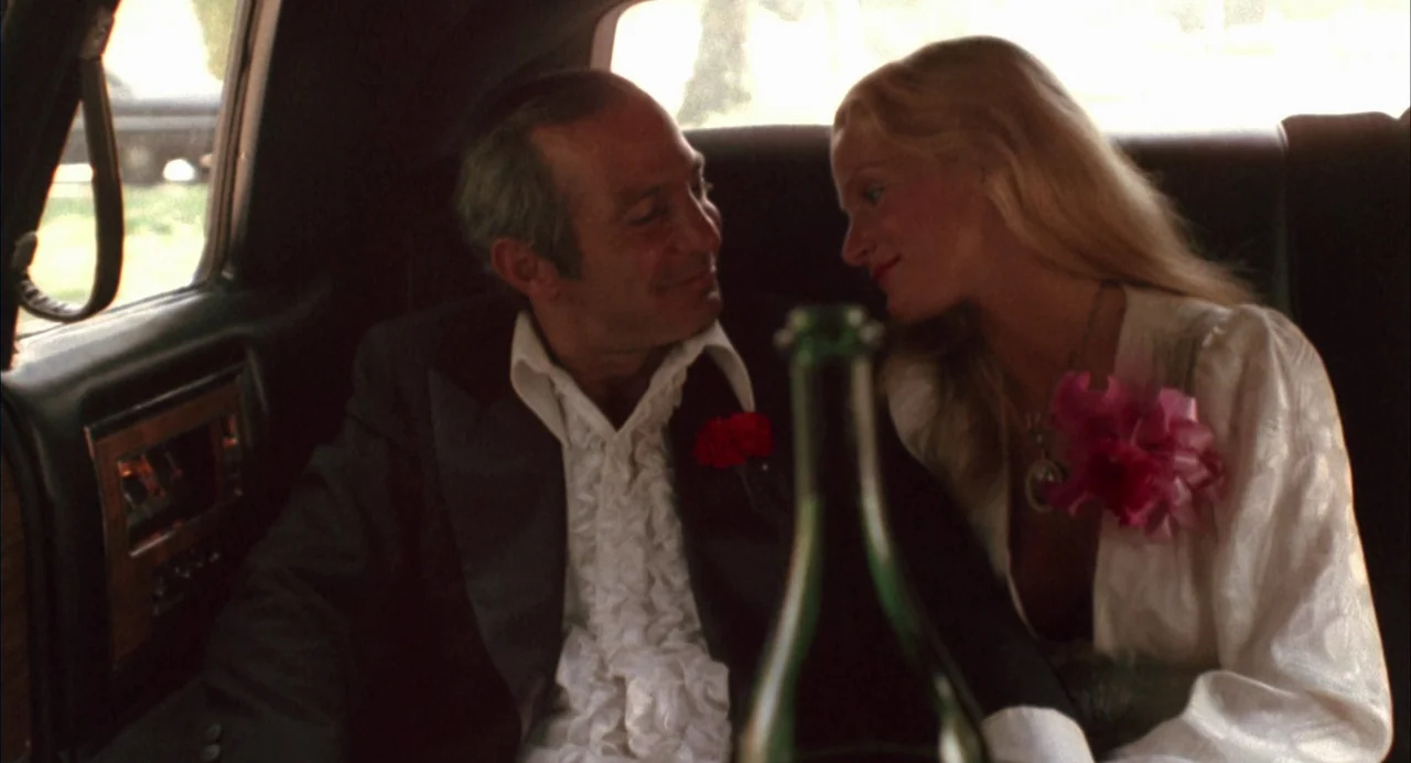 The Killing of a Chinese Bookie (1976) movie still: medium — The interior of a limousine featuring dark leather upholstery and wood grain accents. A…