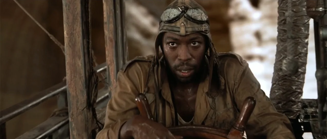 The Mummy Returns (2001) movie still: medium — A cramped, weathered boat cockpit features worn wooden controls and rustic structural components. A…