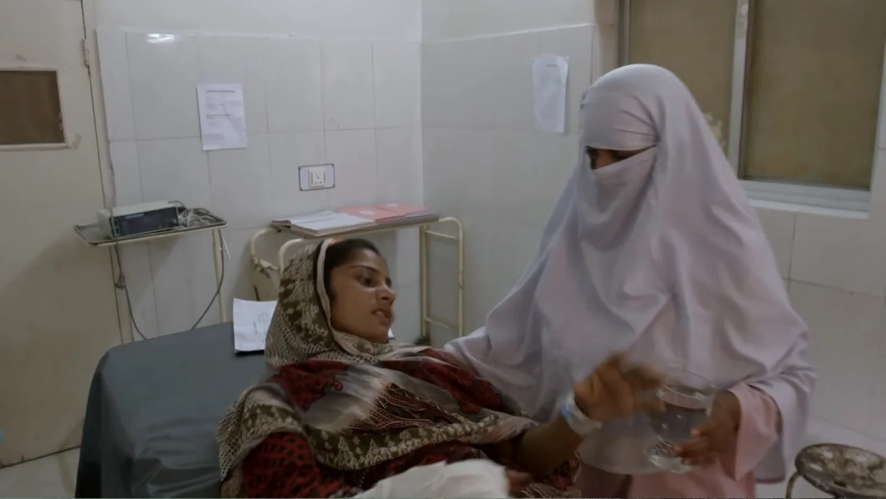 A Girl in the River: The Price of Forgiveness (2015) movie still: medium — A clinical hospital room with white tiled walls and basic medical…
