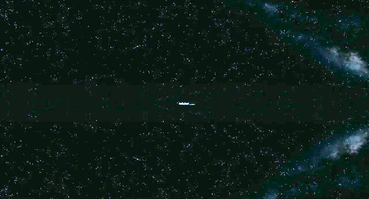 Life of Pi (2012) movie still: establishing — An expanse of deep black space filled with a dense field of distant stars. A small white spacecraft or…