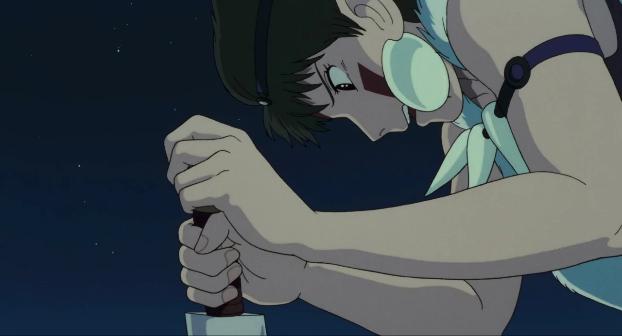 Princess Mononoke (1997) movie still: medium — A dark, star-filled night sky forms the background for a character. The young woman leans forward,…
