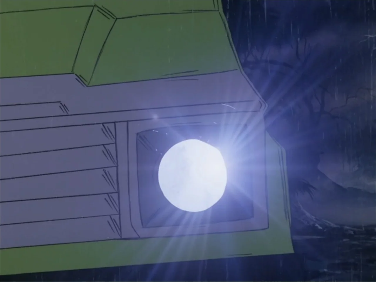 Scooby-Doo! Meets the Boo Brothers (1987) movie still: closeup — The front corner of a lime green vehicle sits in a dark, rainy landscape. A single…