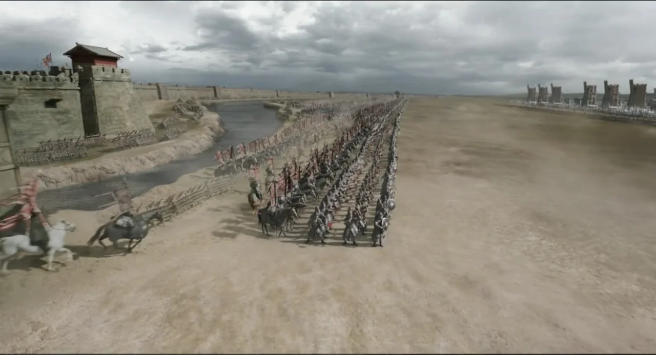 Legends of the Condor Heroes: The Gallants (2025) movie still: wide — A sprawling, dusty battlefield sits before a large stone fortification under a…