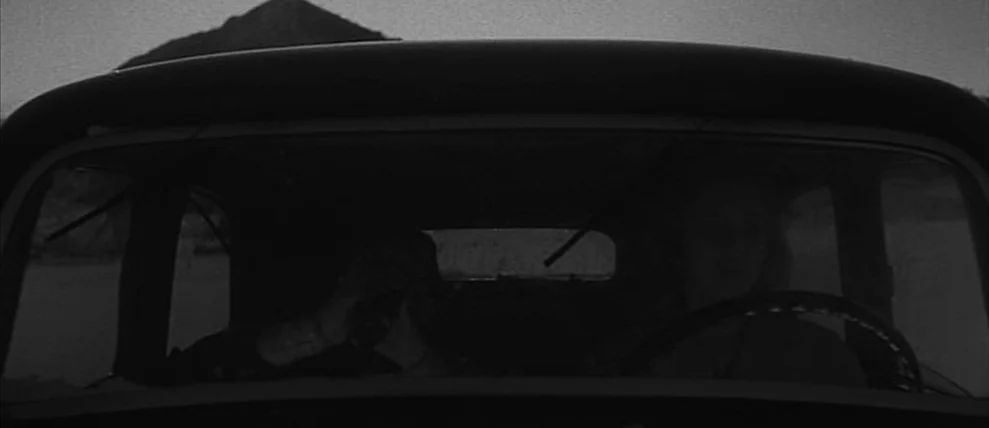 Shoot The Piano Player (Tirez Sur Le Pianiste) (1960) movie still: medium — Two people occupy the front seats of a vintage car during a daytime…