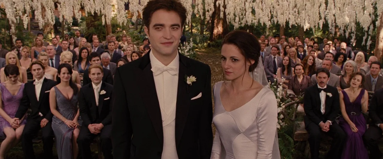 The Twilight Saga: Breaking Dawn – Part 1 (2011) movie still: medium — An outdoor wedding ceremony surrounded by rows of seated guests and hanging…
