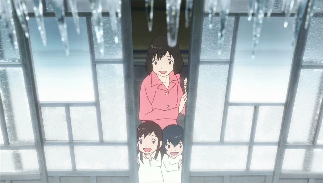 Wolf Children (2012) movie still: medium — A Japanese-style home entrance with large frosted glass panels and hanging icicles above. A woman and two…