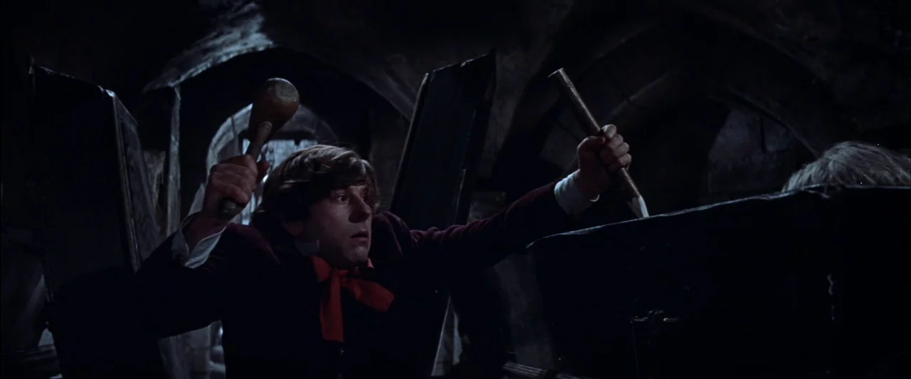 The Fearless Vampire Killers (1967) movie still: medium — A stone crypt features arched ceilings and dark surroundings with multiple coffins…