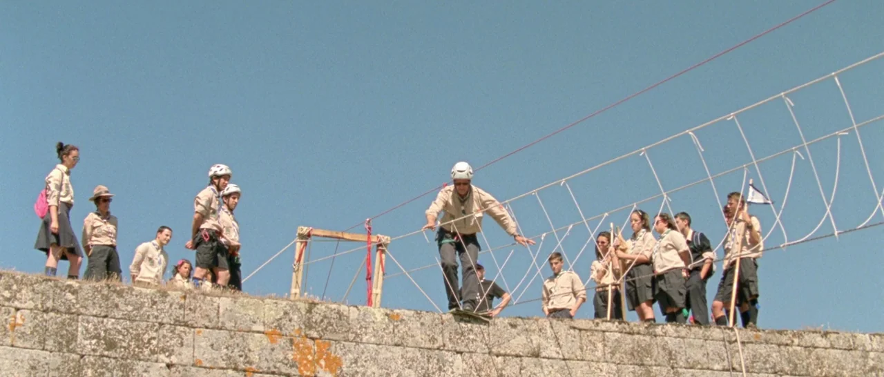 Arabian Nights: Volume 2 The Desolate One (2015) movie still: wide — A group of scouts stands on a high, weathered stone masonry wall in daylight.…
