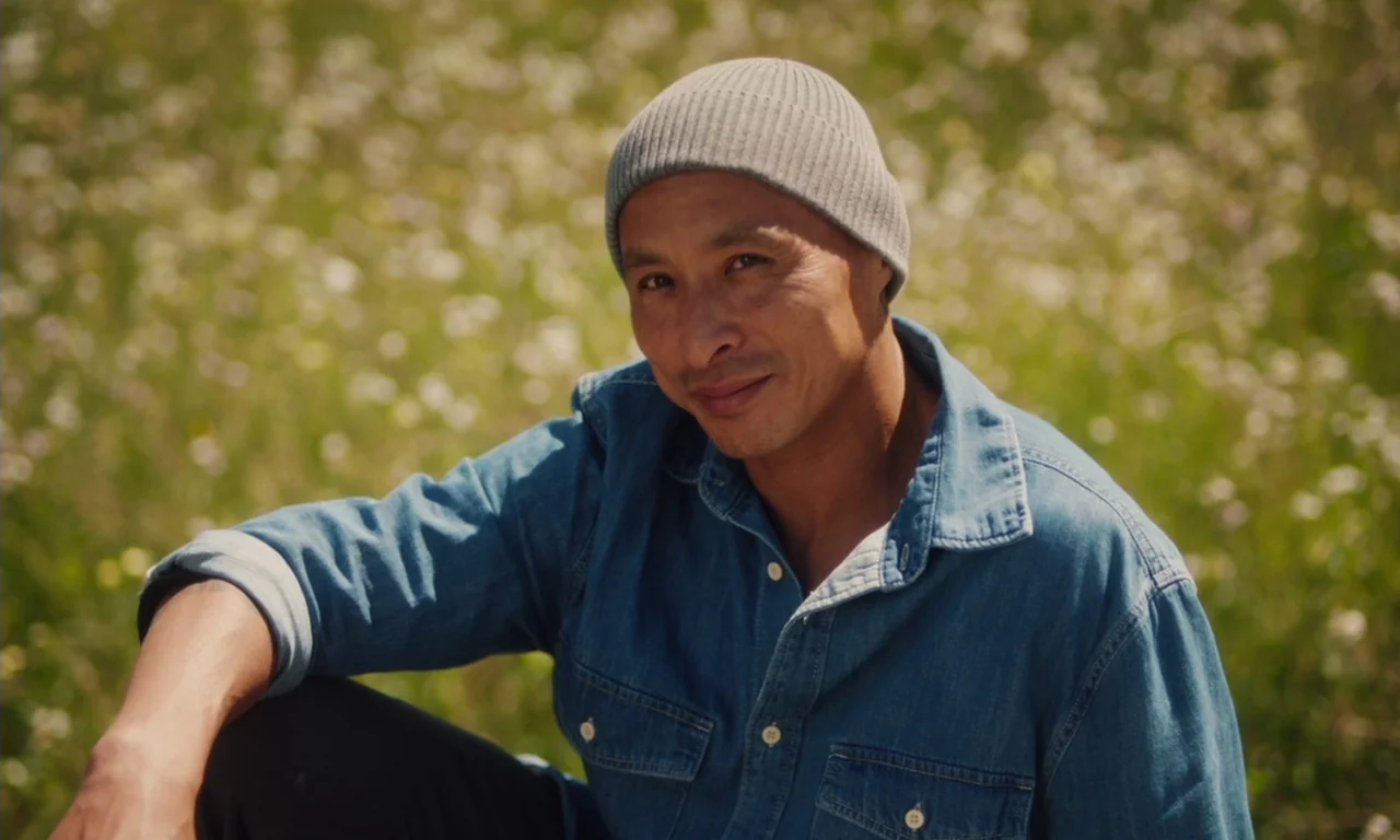 The Last Black Man in San Francisco (2019) movie still: medium — A field filled with wildflowers serves as the backdrop for the portrait. An East…