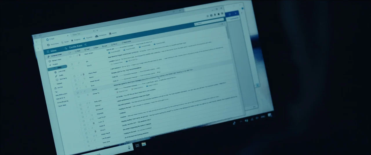 The Invisible Man (2020) (2020) movie still: closeup — A close-up shot focuses on a laptop screen showing an active email inbox browser. The…