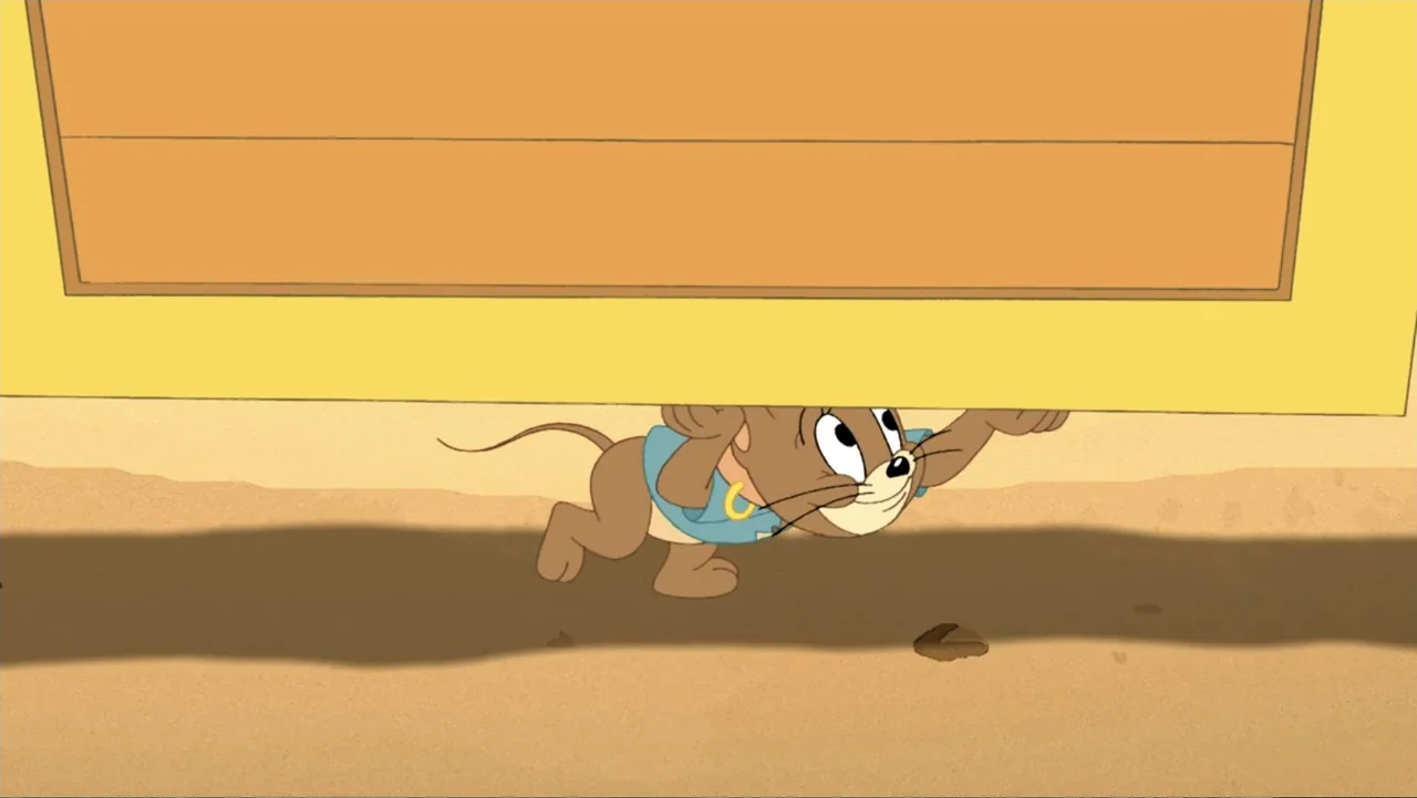 Tom and Jerry: Shiver Me Whiskers (2006) movie still: medium — A cartoon mouse lifts a large yellow rectangular object above its head. The setting…