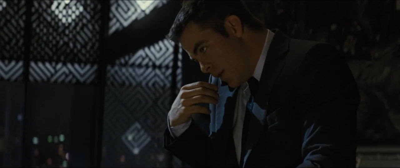 Jack Ryan: Shadow Recruit (2014) movie still: medium — A dark modern interior features a geometric patterned glass partition and city lights…