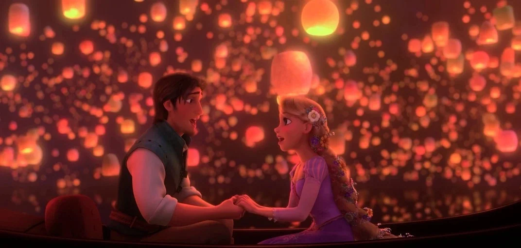 Tangled (2010) movie still: medium — A man and a woman sit inside a wooden boat floating on dark water. Countless glowing paper lanterns float in…