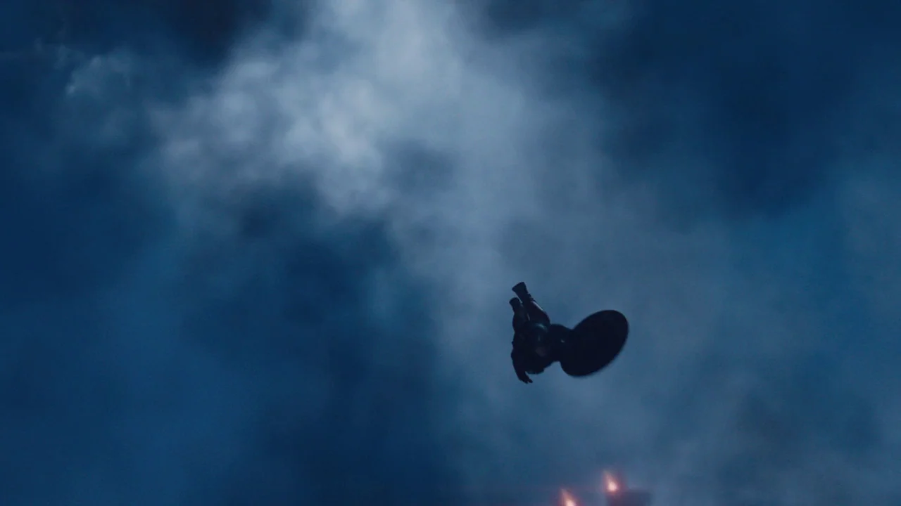 The Avengers (2012) movie still: wide — A dark, cloud-filled night sky at a high altitude. A lone figure falls headfirst with a circular shield…