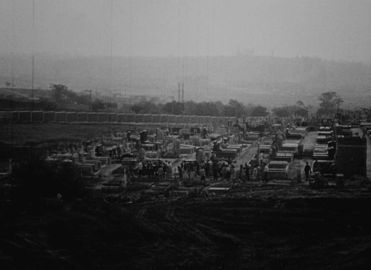 At Midnight I’ll Take Your Soul (1964) movie still: establishing — A wide aerial view of a cemetery with many stone grave markers and plots. A…