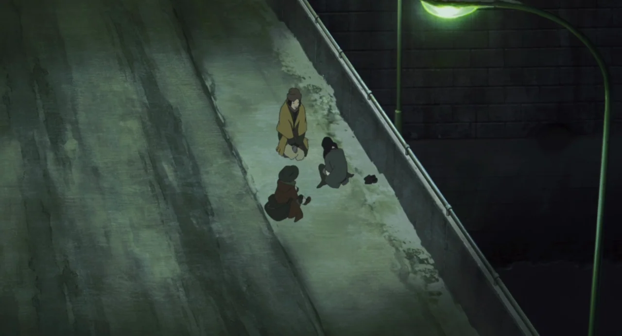 Tokyo Godfathers (2003) movie still: wide — A concrete pedestrian walkway is illuminated by a singular green streetlamp at night. Three people sit…