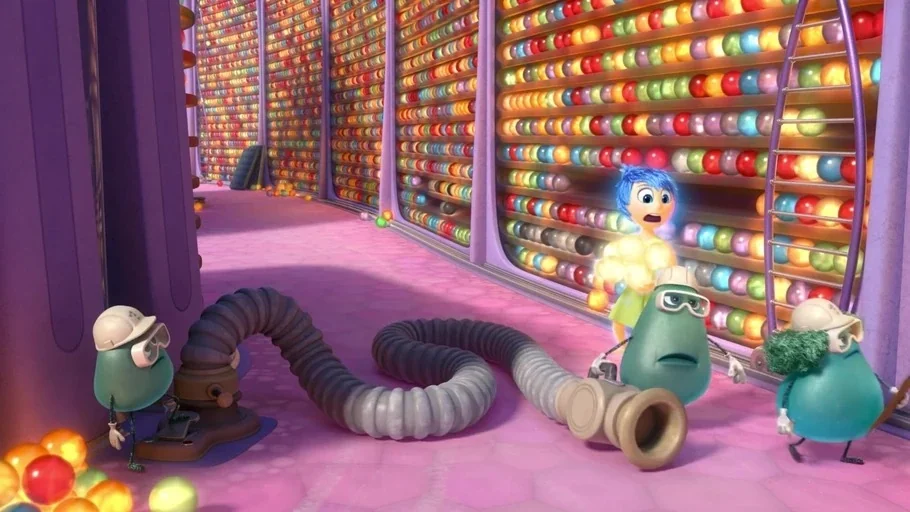 Inside Out (2015) movie still: wide — A tall archive containing endless shelves filled with small, colorful glowing spherical memories. Several…