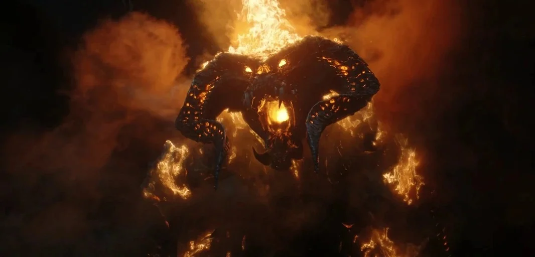 The Lord of the Rings: The Rings of Power (2022) movie still: closeup — A dark subterranean space filled with thick smoke and embers. A massive…