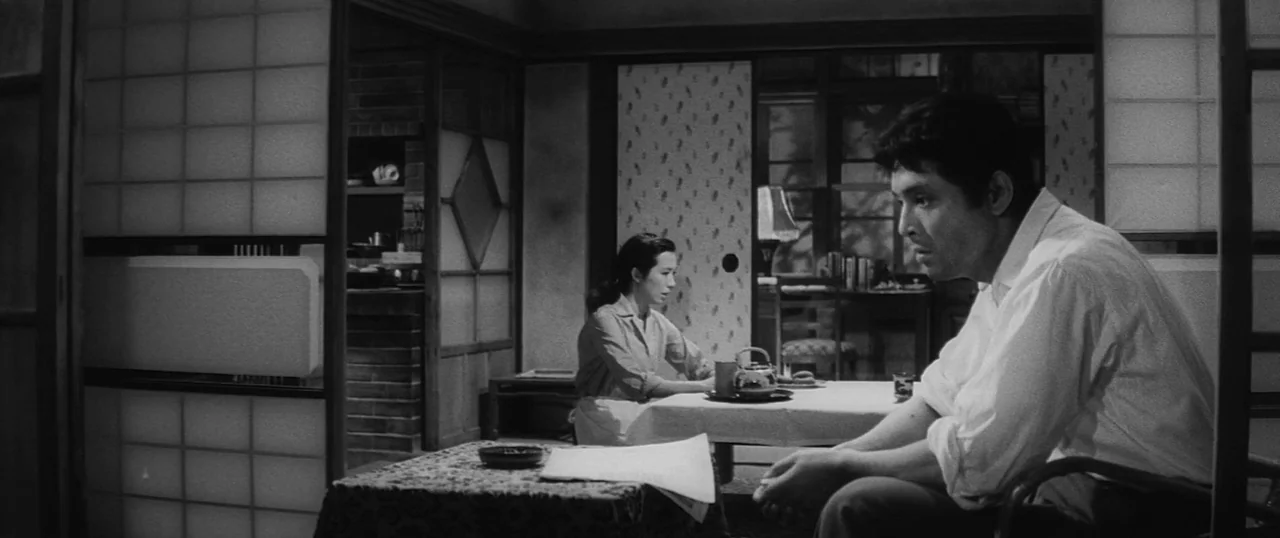 The Human Condition I: No Greater Love (1959) movie still: medium — A Japanese interior features shoji screens and a table set for a meal. A man…