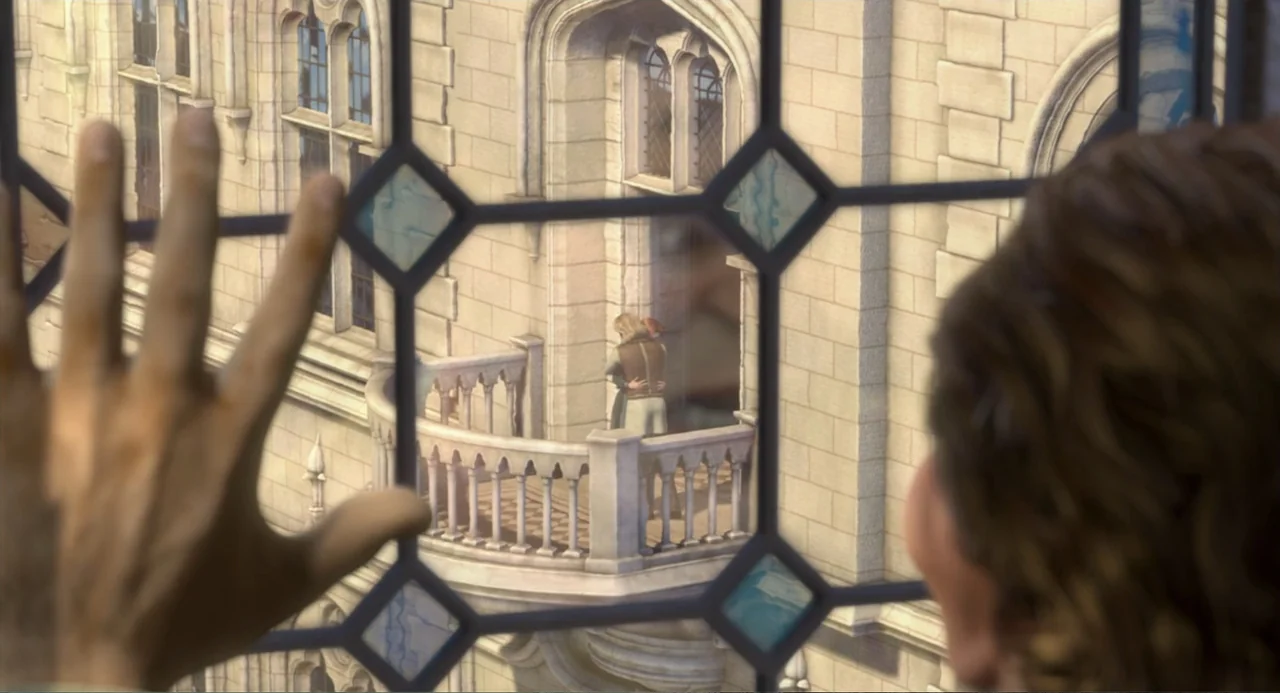 Shrek 2 (2004) movie still: medium — A stone balcony extends from a large castle structure with ornate leaded glass windows. A man and a woman stand…