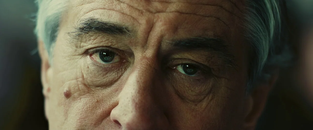 Limitless (2011) movie still: closeup — A close-up of an elderly man's face fills the entire frame. The camera is fixed on his eyes, highlighting…