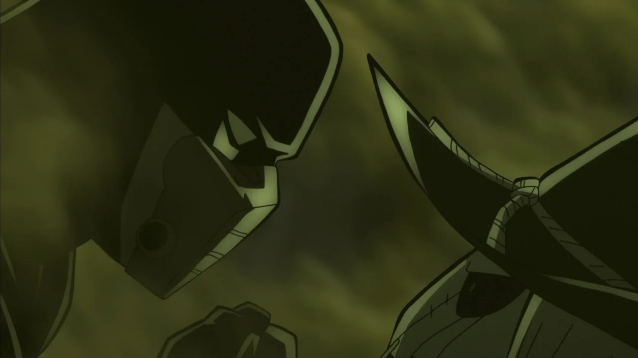 Batman: The Long Halloween, Part Two (2021) movie still: medium — Two armored figures confront each other in a dimly lit, monochromatic green…