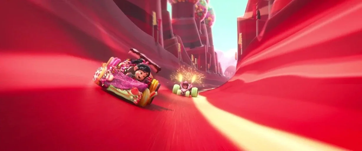 Ralph Breaks the Internet (2018) movie still: wide — A candy-themed racetrack featuring curved red terrain and tall chocolate-like rock formations.…