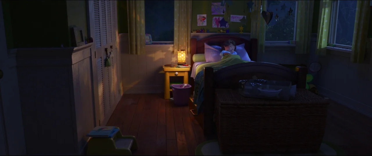 Toy Story 4 (2019) movie still: wide — A child is asleep in a dark bedroom during the nighttime. A small illuminated bedside lamp casts light across…