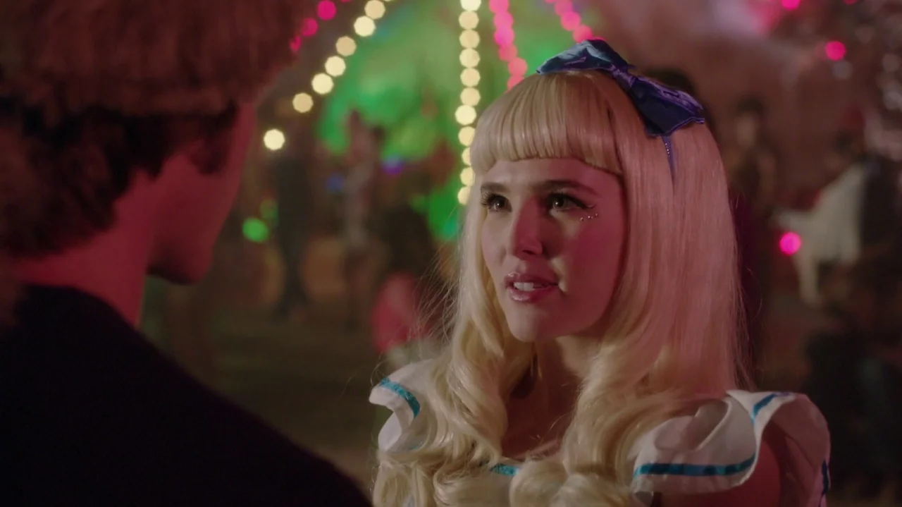 Everybody Wants Some!! (2016) movie still: medium — A fairground at night filled with blurred multi-colored lights in the background. A young blonde…