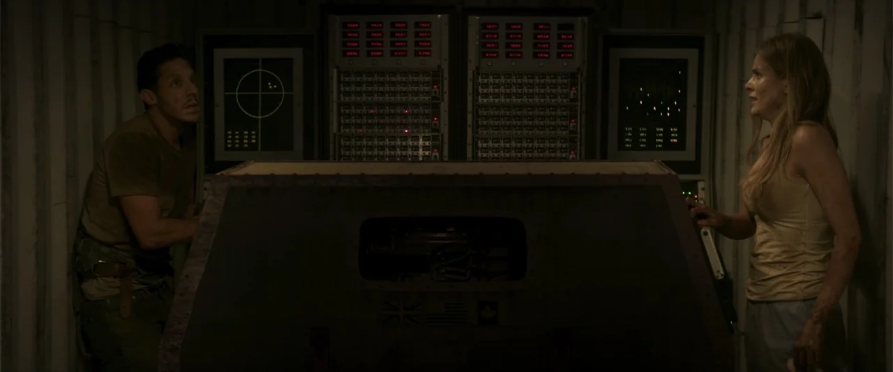 Treblinka's Last Witness (2012) movie still: medium — A dark, metallic room is filled with technical electronics and glowing monitor interfaces. A…