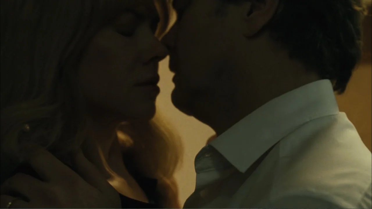 Before I Go to Sleep (2014) movie still: closeup — A dark indoor setting features the close proximity of two people in minimal light. A woman and a…