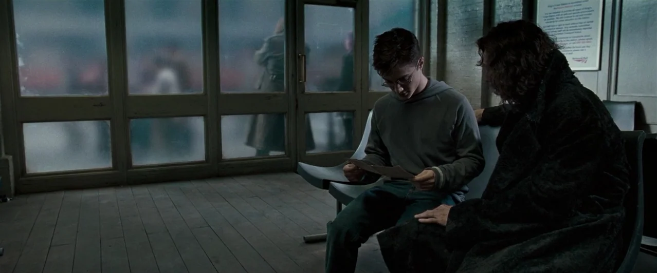 Harry Potter & The Order of the Phoenix (2007) movie still: medium — A quiet indoor waiting area with large glass-paned walls looking out at a…