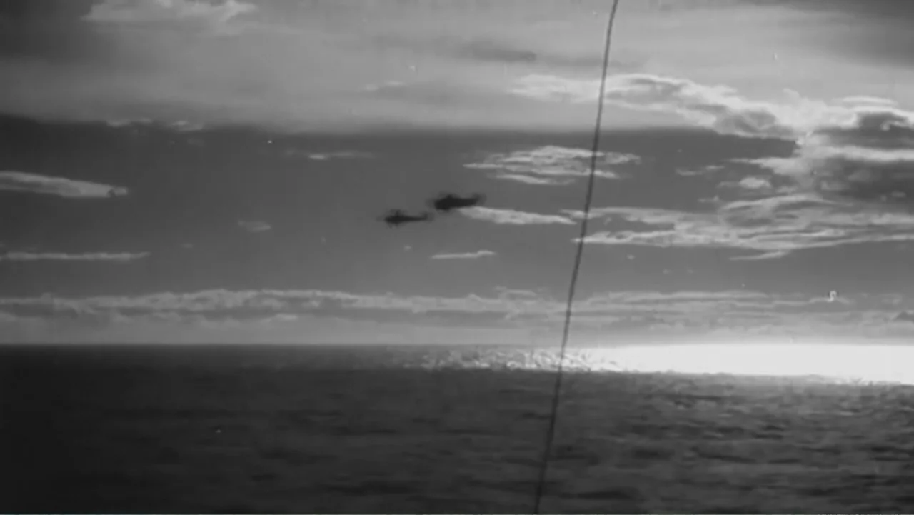 Finding Amelia (2024) movie still: establishing — A vast expanse of ocean meets a cloudy sky during a bright sunset period. Two small aircraft are…
