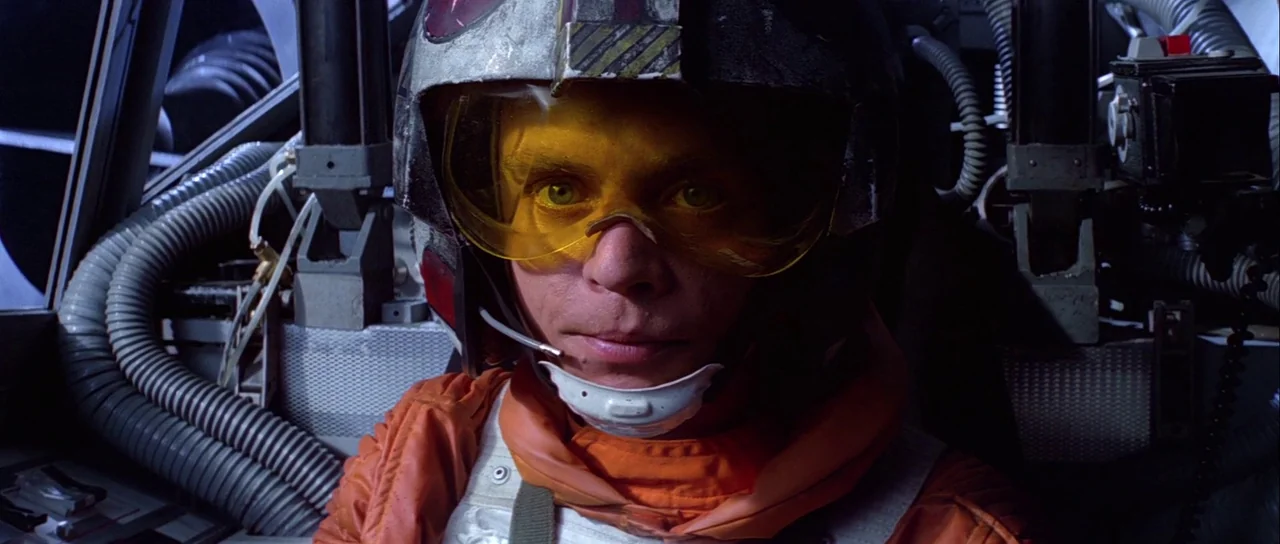 The Empire Strikes Back (1980) movie still: closeup — The interior of a military spacecraft cockpit features complex control panels and exposed…