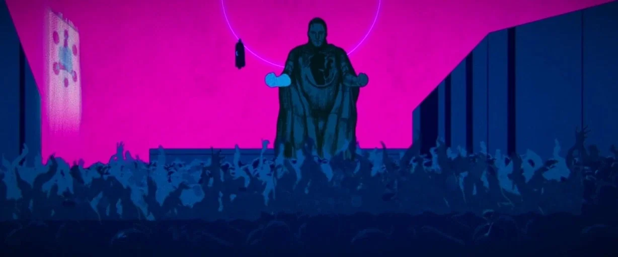 Archenemy (2020) movie still: wide — A high-contrast stylized auditorium interior features a central platform with a large magenta screen. A figure…